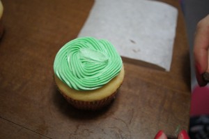 Icing a cupcake