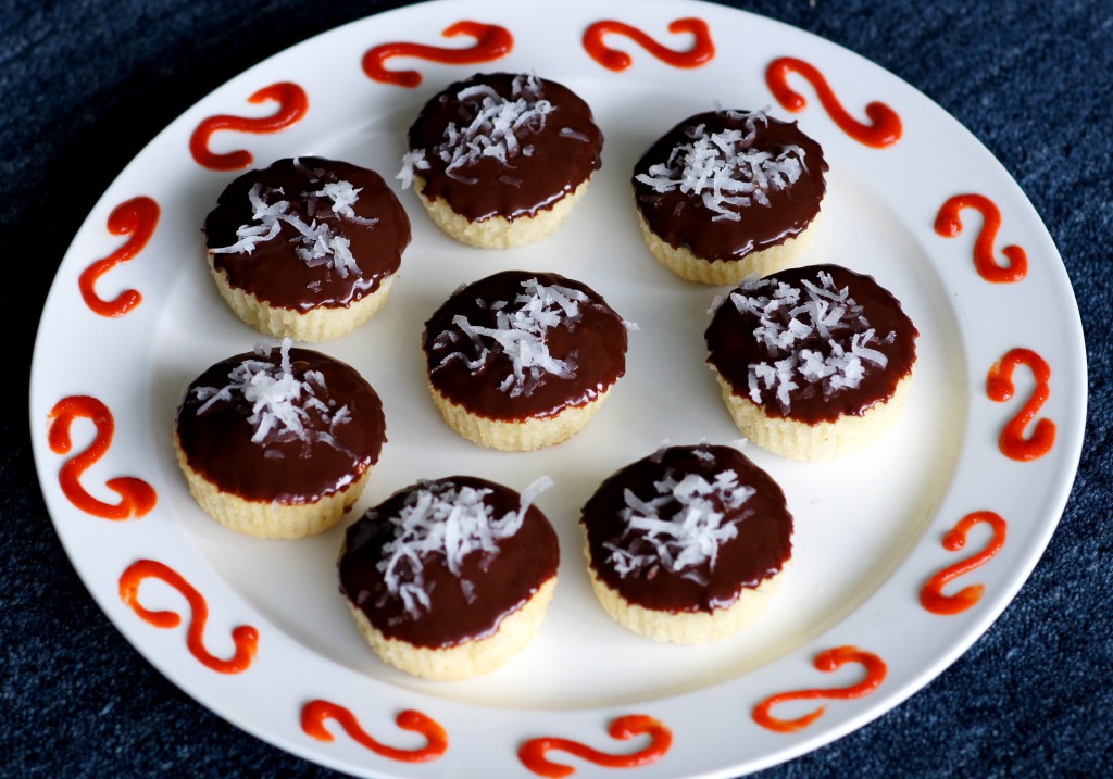 Coconut Cupcakes with Chocolate-Sriracha Ganache image