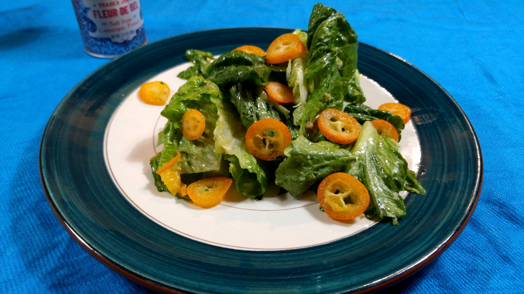 Chopped Romaine Lettuce Dressed with a Classic French Dijon Vinaigrette and Sliced Kumquats