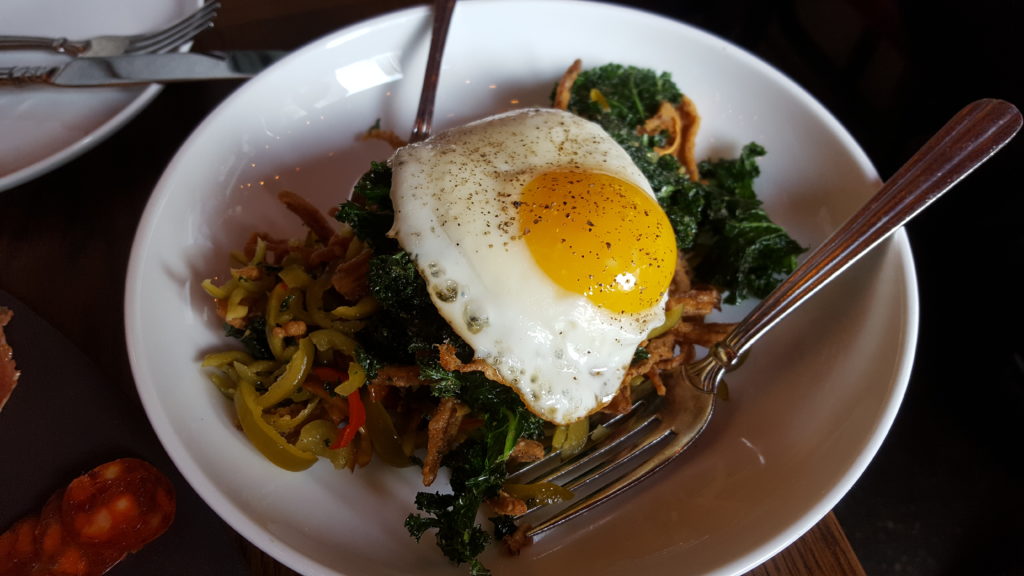Pig Ear with Crispy Kale, Pickled Cherry Peppers, and Fried Egg