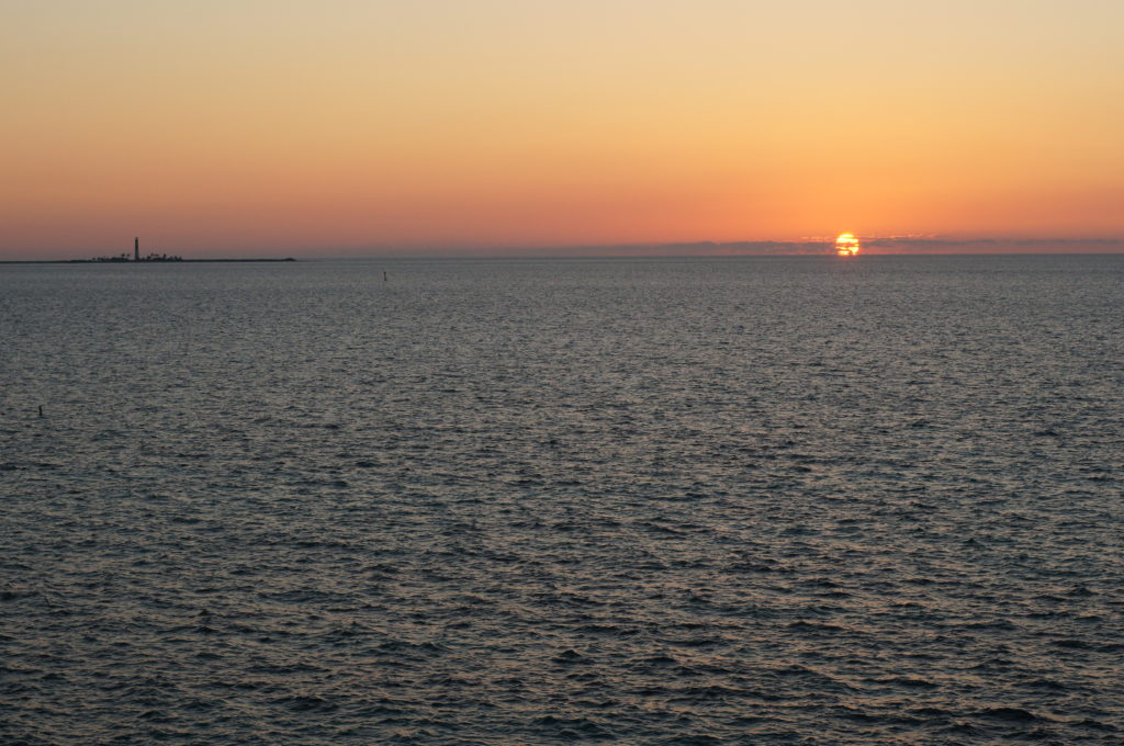 The Sunset from Fort Jefferson; Loggerhead Key and Lighthouse at Left