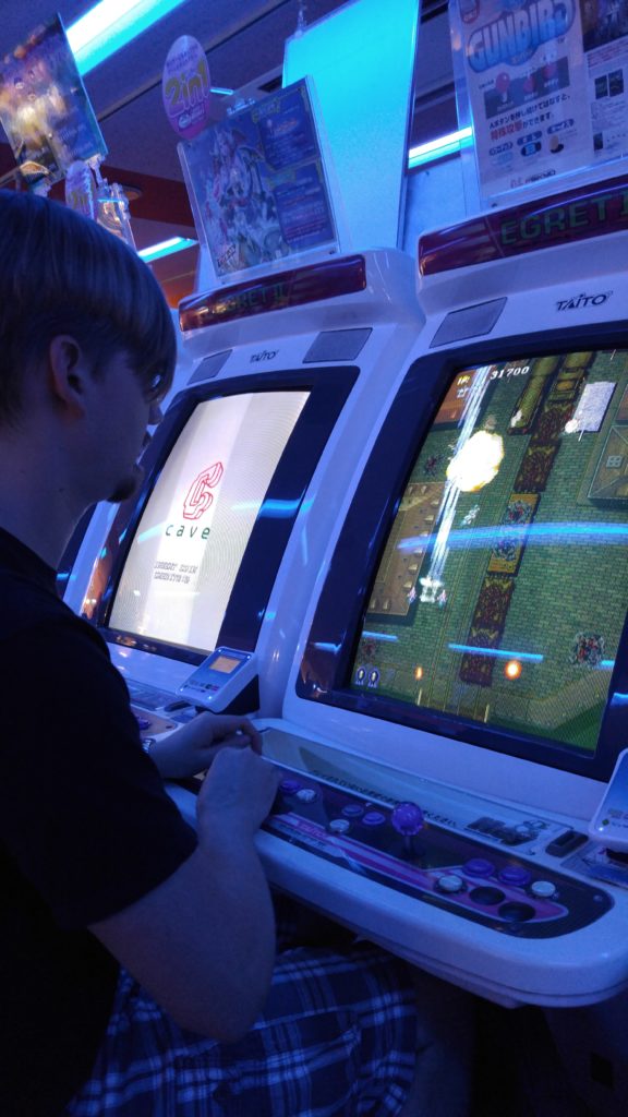 Corey Playing Arcade Games in Akihabara