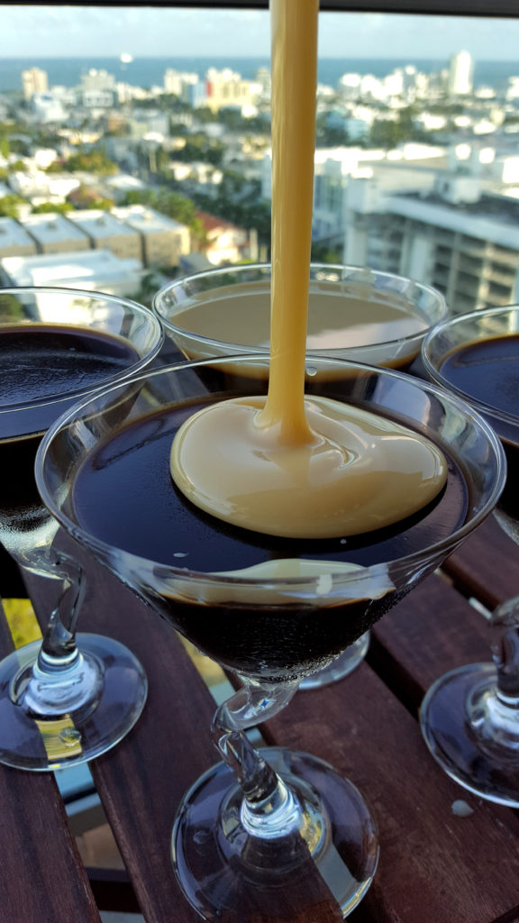Pouring Sweetened Condensed Milk Over Coffee Jelly