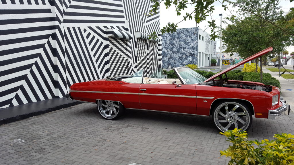 Red Convertible in Front of The Wynwood Building