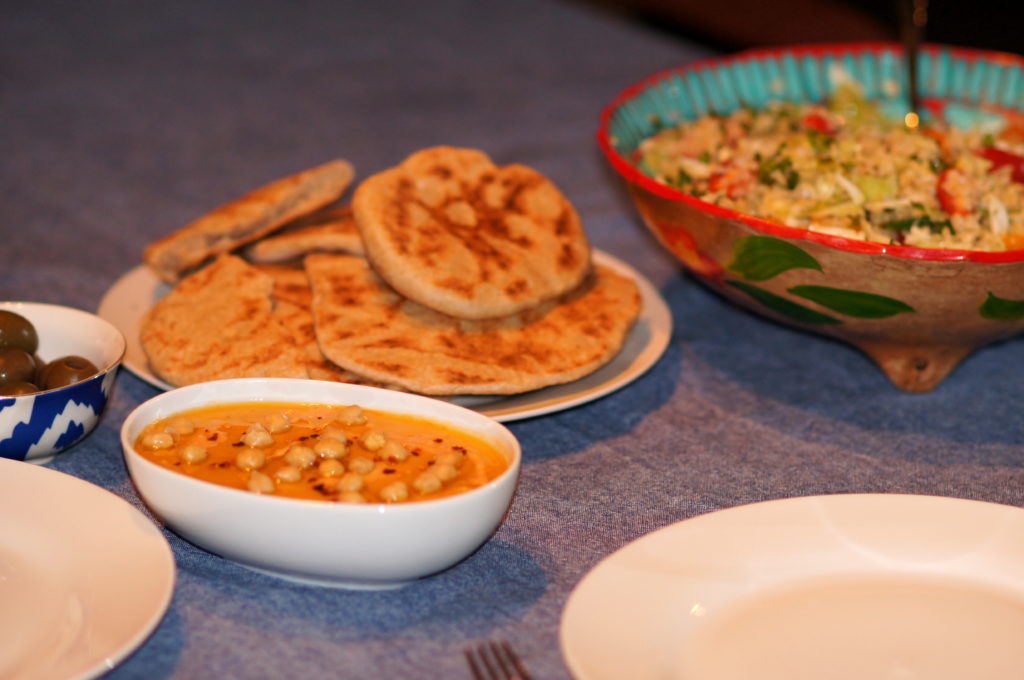 Olives, Harissa Hummus, Homemade Pitas, and Tabouleh with Baharat Seasoning 