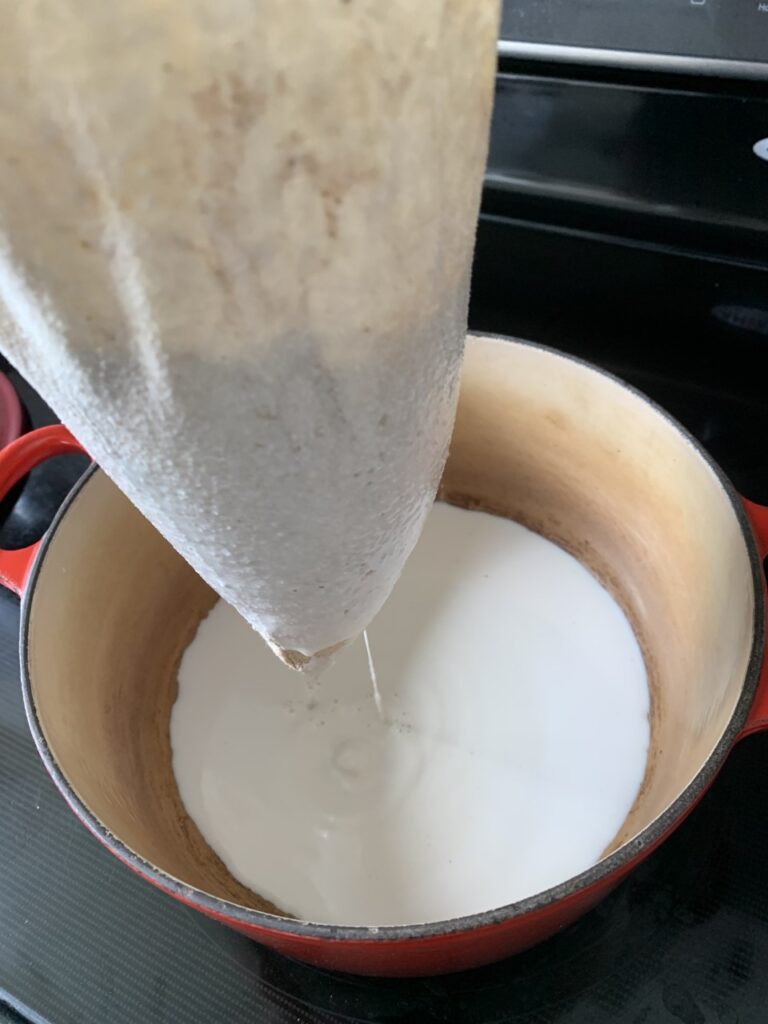 Straining Peanut Mixture into Saucepan